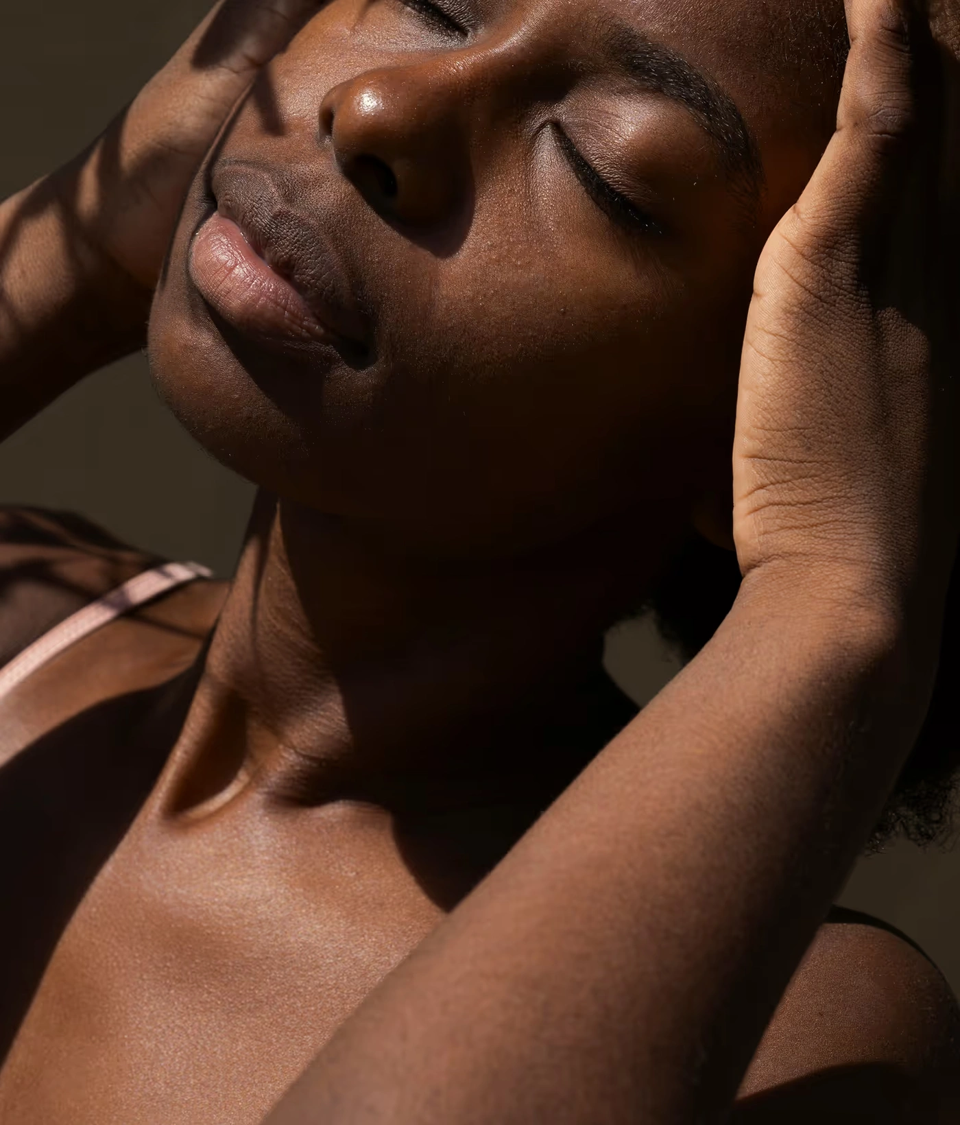Close-up of a woman with lifted, luminous skin